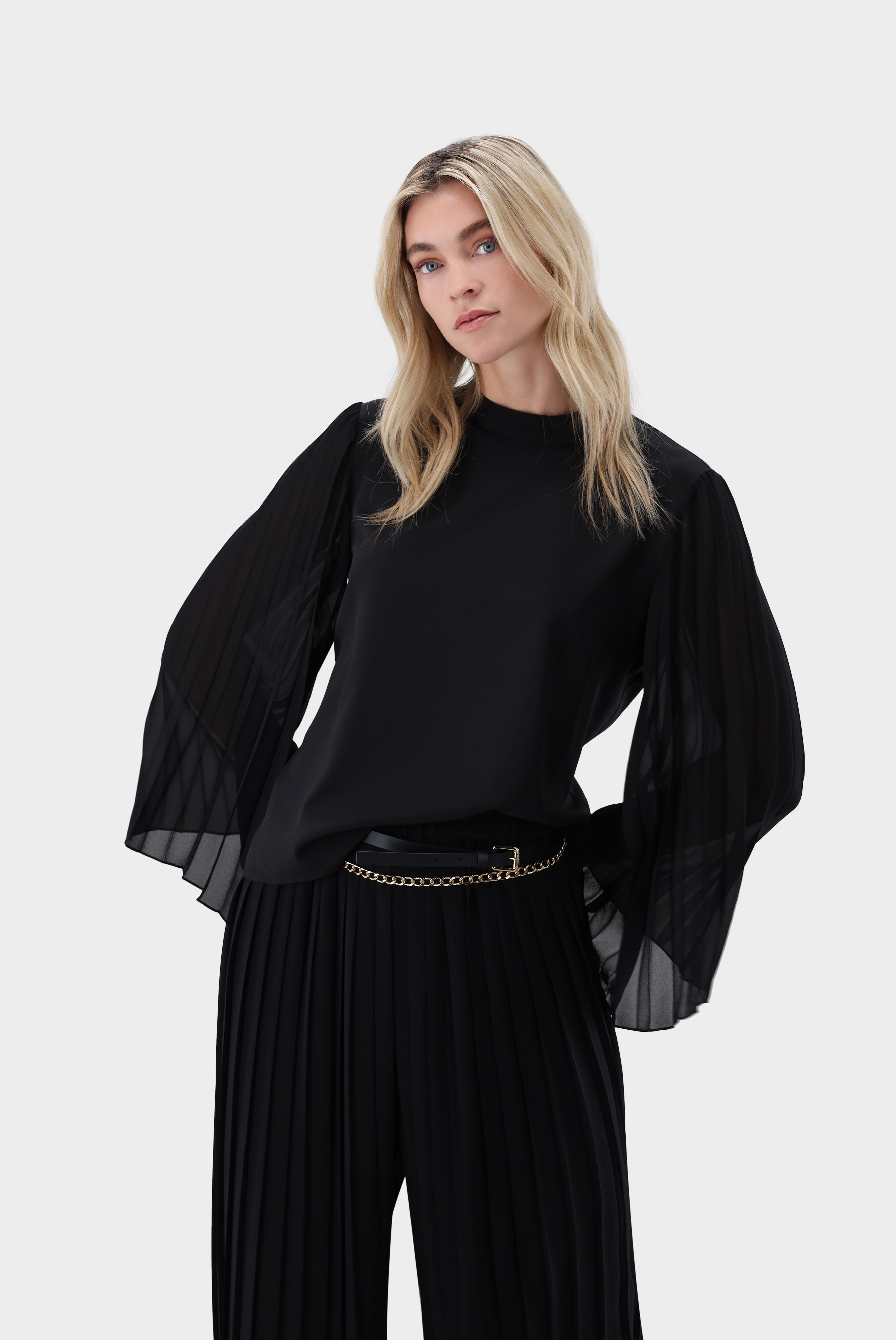 Blouse with pleated sleeves