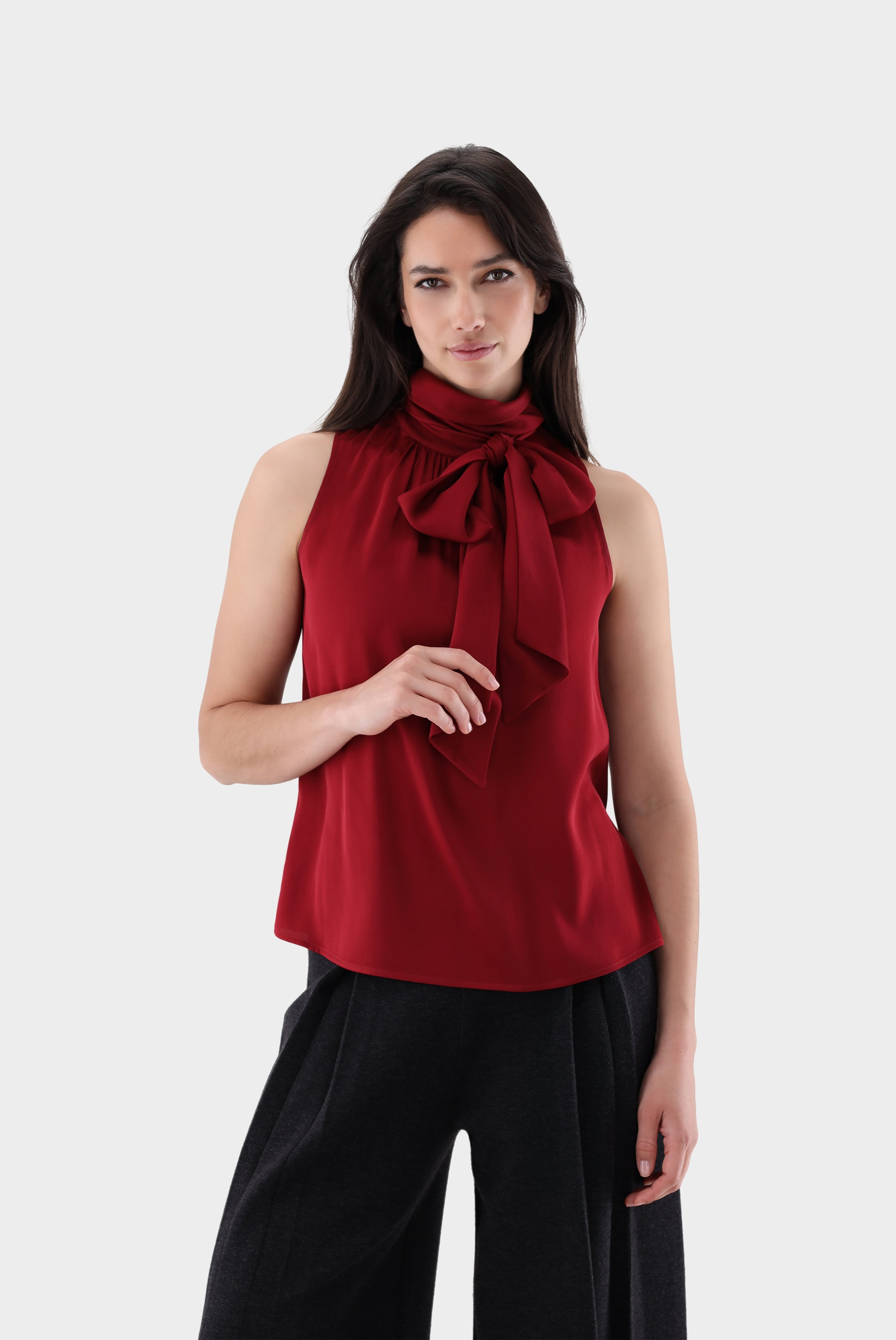Sleeveless silk blouse with bow detail