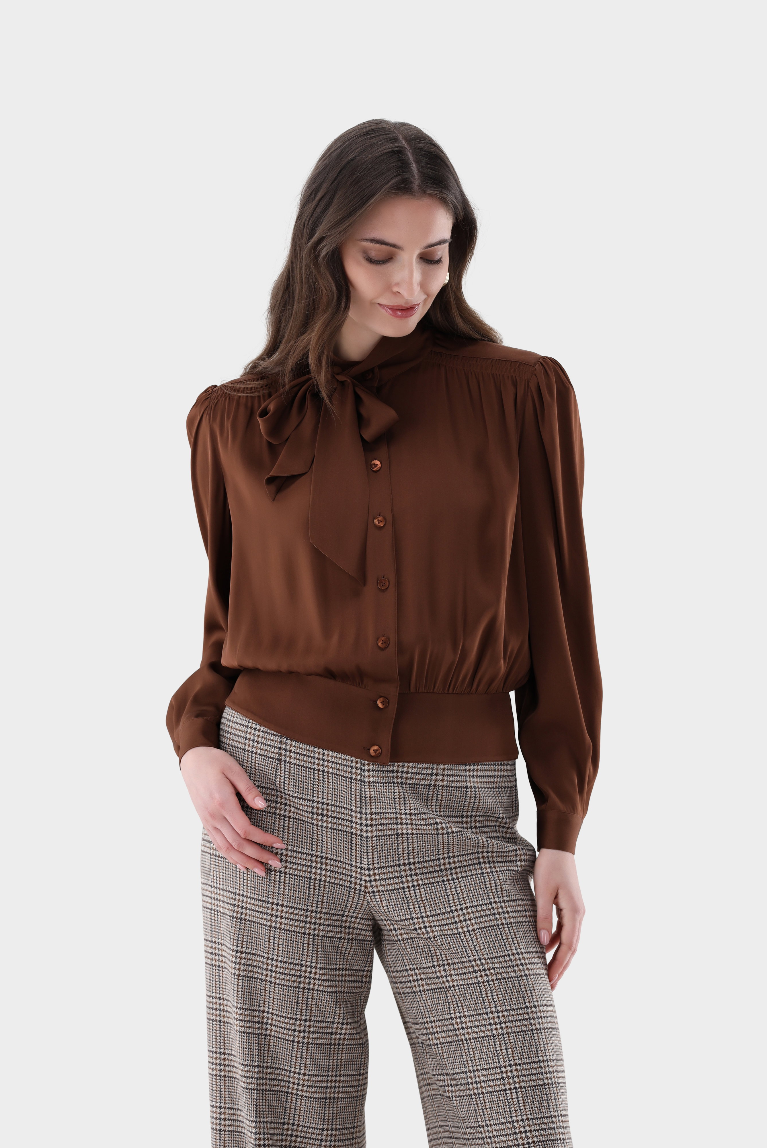Pussy-bow blouse with gathered peplum